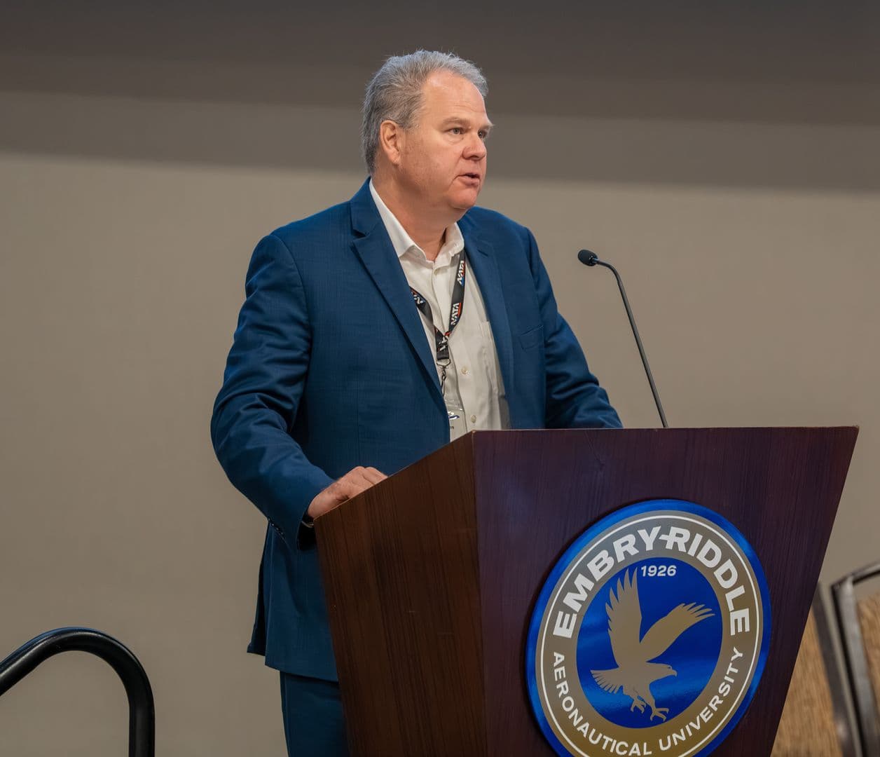Greg Johnson of Tuvoli speaking at the podium at Embry-Riddle Aeronautical University
